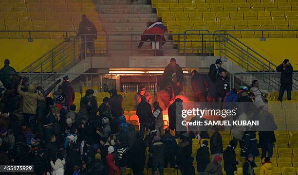 Zenit's fans light flares during the UEFA Champions League group G football match FK Austria Wien vs FC Zenit in Vienna, on December 11, 2013. AFP...