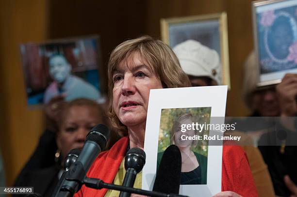 Teresa Rousseau holds a photo of her daughter Lauren Rousseau who was a substitute teacher when she was killed at Sandy Hook Elementary School nearly...