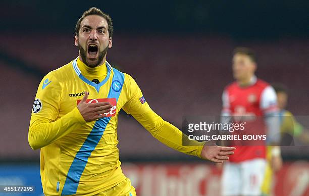 Napoli's Argentinian forward Gonzalo Higuain celebrates after scoring during the UEFA Champion's League group F football match between SSC Napoli and...