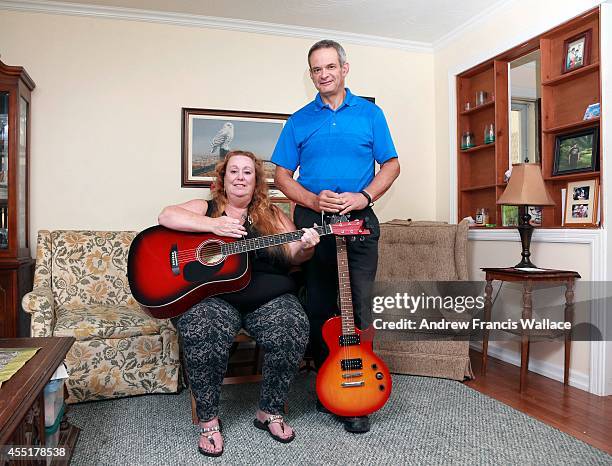 Jim Crosby and his wife Lorraine Charland poses at their Oshawa home, September 9, 2014. The couple talks about their emotional roller coaster when...