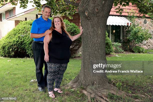 Jim Crosby and his wife Lorraine Charland poses at their Oshawa home, September 9, 2014. The couple talks about their emotional roller coaster when...