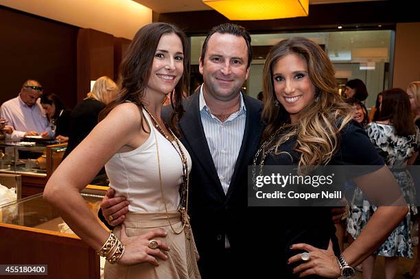 Tia Wynne and Jamie Singer pose for a photo with a guest during the "Enduring Style" fall campaign party hosted by Vogue and David Yurman at the...