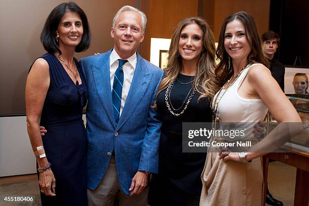 Regen Fearon, Dr. Jeffrey Fearon, Jamie Singer and Tia Wynne pose for a photograph the "Enduring Style" fall campaign party hosted by Vogue and David...