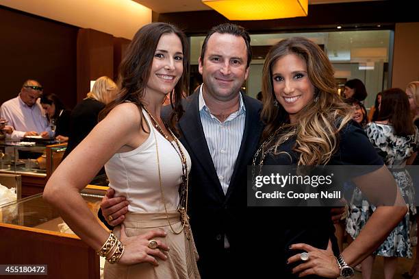 Tia Wynne and Jamie Singer pose for a photo with a guest during the "Enduring Style" fall campaign party hosted by Vogue and David Yurman at the...