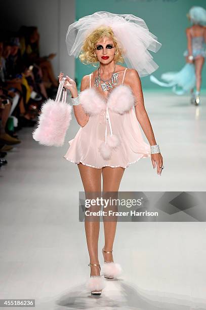 Camille Grammer walks the runway at the Betsey Johnson fashion show during Mercedes-Benz Fashion Week Spring 2015 at The Salon at Lincoln Center on...