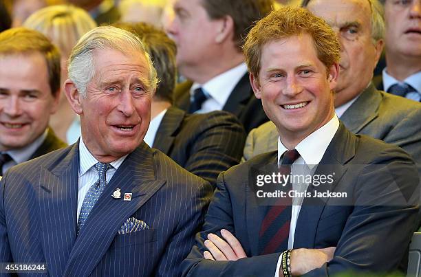 Prince Charles, Prince of Wales and Prince Harry laugh during the Invictus Games Opening Ceremony on September 10, 2014 in London, England. The...