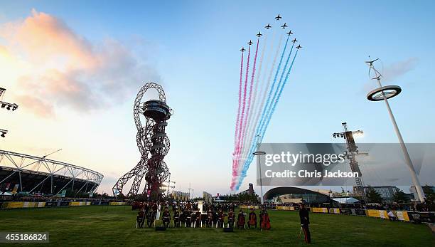 The Reds Arrows RAF Display Team fly over the Orbit at the Queen Elizabeth II Park during the Invictus Games Opening Ceremony on September 10, 2014...