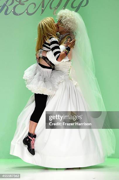 Designer Betsey Johnson and Sharon Needles walk the runway at the Betsey Johnson fashion show during Mercedes-Benz Fashion Week Spring 2015 at The...