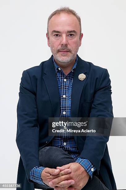 Designer John Patrick poses backstage at the Organic By John Patrick runway show during Mercedes-Benz Fashion Week Spring 2015 on September 10, 2014...