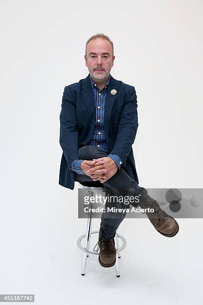 Designer John Patrick poses backstage at the Organic By John Patrick runway show during Mercedes-Benz Fashion Week Spring 2015 on September 10, 2014...