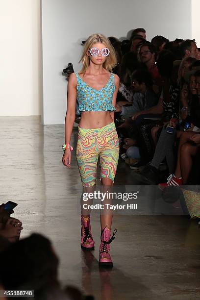 Model walks the runway during the Jeremy Scott show at Mercedes-Benz Fashion Week Spring 2015 at Milk Studios on September 10, 2014 in New York City.