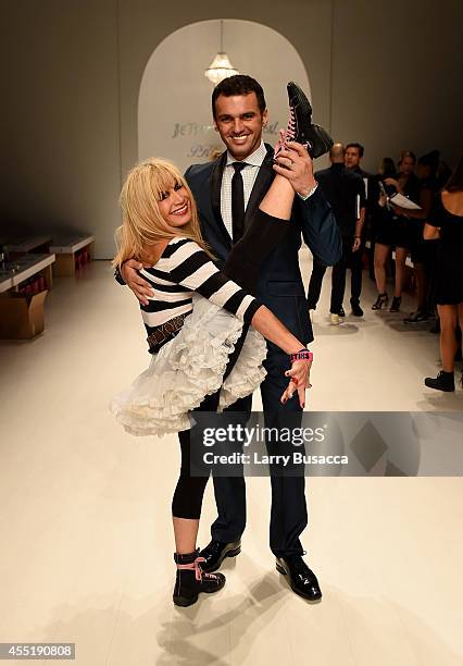 Designer Betsey Johnson and Tony Dovolani dance on the runway at the Betsey Johnson fashion show during Mercedes-Benz Fashion Week Spring 2015 at The...