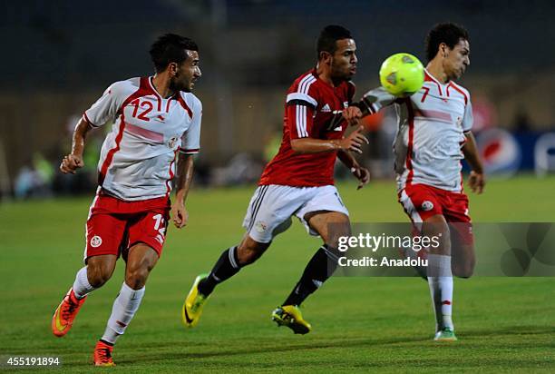 Hazem Emam of Egypt in action against Youssef Msakni of Tunisia during the African Cup of Nations qualifiers group G soccer match between Egypt and...