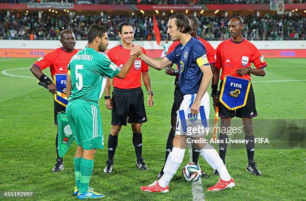Mohsine Moutaouali the captain of Raja Casablanca and Ivan Vicelich the captain of Auckland City FC shakes hands before the FIFA Club World Cup...