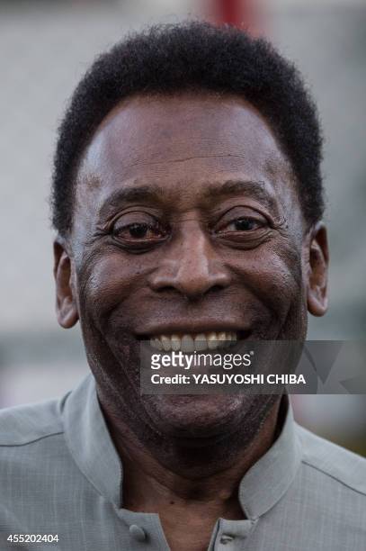 Legendary Brazilian former football player Pele smiles during the inauguration ceremony of the new technology football pitch installed at Mineira...