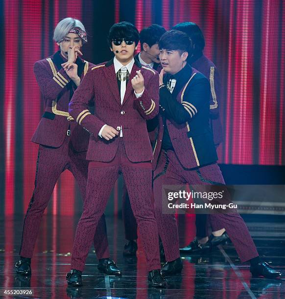 Super Junior perform on stage during the MBC Music "Show Champion" on September 10, 2014 in Ilsan, South Korea.