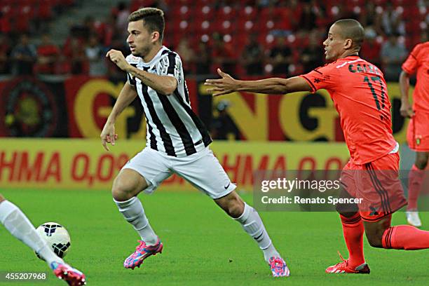 Wendell of Sport Recife battles for the ball with Thiago Ribeiro of Santos during the Brasileirao Series A 2014 match between Sport Recife and Santos...