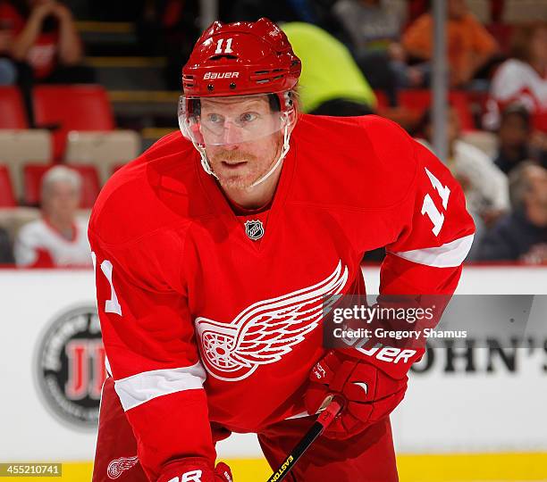 Daniel Alfredsson of the Detroit Red Wings takes a break while playing the Phoenix Coyotes at Joe Louis Arena on October 10, 2013 in Detroit,...