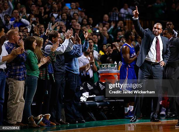 Los Angeles Clippers head coach, Doc Rivers, acknowledges the crowd at the end of the first quarter against his former team, the Boston Celtics,...