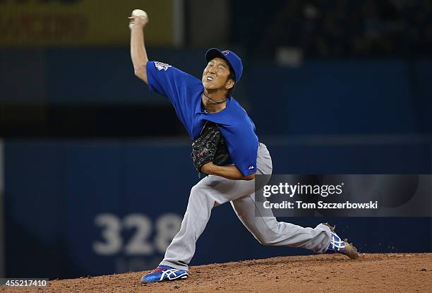 Kyuji Fujikawa of the Toronto Blue Jays delivers a pitch in the seventh inning during MLB game action against the Chicago Cubs on September 10, 2014...