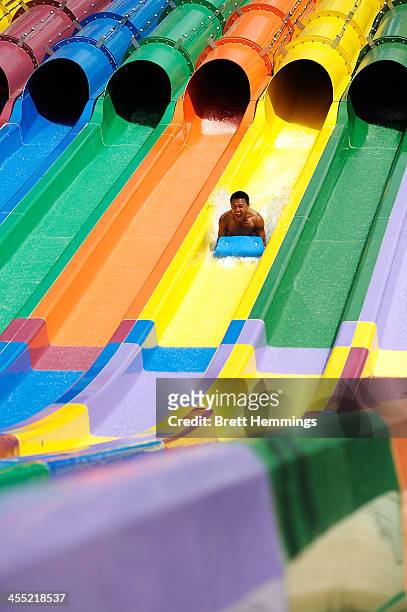 Boy enjoys a waterslide at the opening of Sydney theme park, Wet'n'Wild on December 12, 2013 in Sydney, Australia. The new water park, featuring 42...