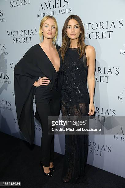 Models Candice Swanepoel and Lily Aldridge attend Russell James' "Angels" book launch hosted by Victoria's Secret on September 10, 2014 in New York...