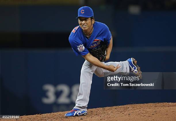Kyuji Fujikawa of the Toronto Blue Jays delivers a pitch in the seventh inning during MLB game action against the Chicago Cubs on September 10, 2014...