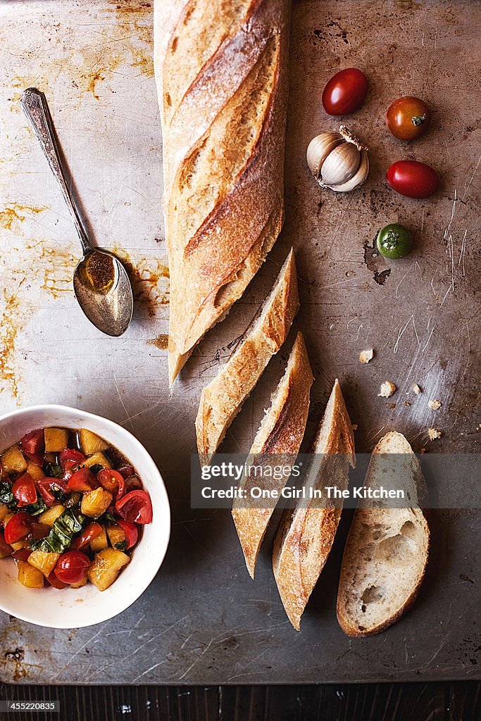 Sliced baguette and tomato peach bruschetta