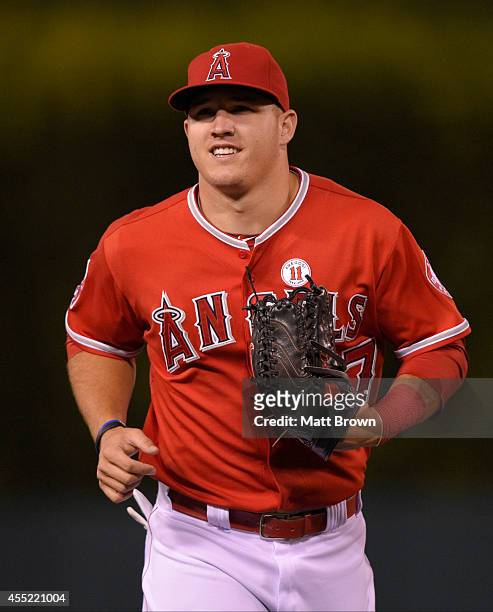 Mike Trout of the Los Angeles Angels of Anaheim smiles during the game against the Philadelphia Phillies on August 12, 2014 at Angel Stadium of...
