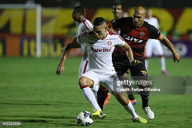 Gilberto of Internacional battles for the ball during the match between Vitoria and Internacional as part of Brasileirao Series A 2014 at Estadio...