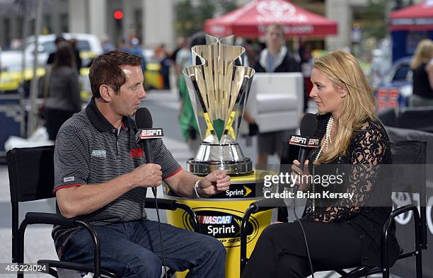 Reporter Nicole Briscoe interviews Greg Biffle, driver of the 3M Call Before You Dig Ford, at a NASCAR Chase Across North America event on September...
