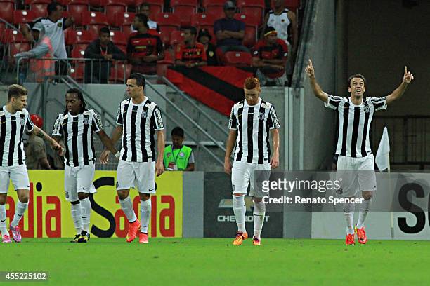 Thiago Ribeiro of Santos celebrates his goal during the Brasileirao Series A 2014 match between Sport Recife and Santos at Arena Pernambuco on...