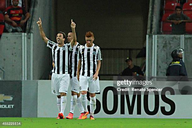 Thiago Ribeiro of Santos celebrates his goal during the Brasileirao Series A 2014 match between Sport Recife and Santos at Arena Pernambuco on...