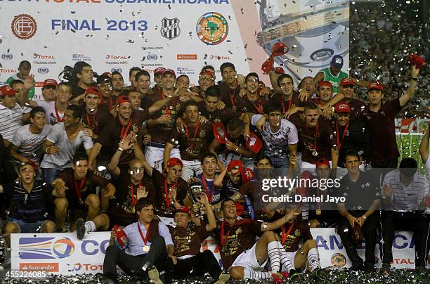 Team members of Lanus, celebrate at the end of the final match between Lanus and Ponte Preta as part of the Copa TOTAL Sudamericana at Nestor Perez...