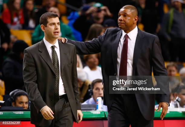 Los Angeles Clippers head coach, Doc Rivers, and Boston Celtics head coach, Brad Stevens, greet each other following the end of game at TD Garden on...