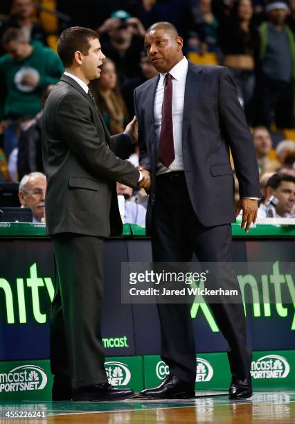 Los Angeles Clippers head coach, Doc Rivers, and Boston Celtics head coach, Brad Stevens, greet each other following the end of game at TD Garden on...