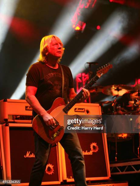 Rick Parfitt of Status Quo performs on stage at BIC on December 11, 2013 in Bournemouth, United Kingdom.