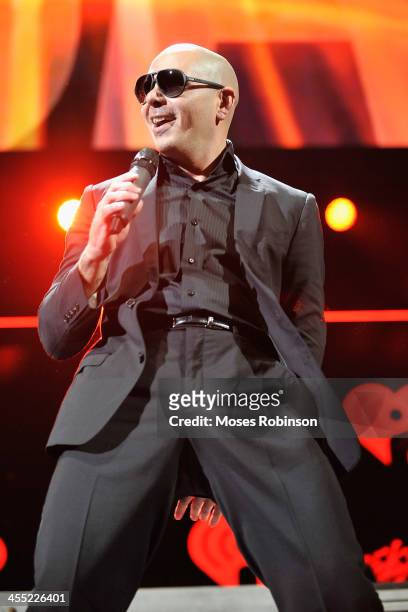 Pitbull performs onstage during Power 96.1's Jingle Ball 2013 at Philips Arena on December 11, 2013 in Atlanta, Georgia.