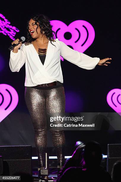 Laura Givens performs with Armin van Buuren onstage during Power 96.1's Jingle Ball 2013 at Philips Arena on December 11, 2013 in Atlanta, Georgia.