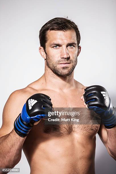 Luke Rockhold poses during the UFC Fight Night: Rockhold v Bisping Press Event at Museum of Contemporary Art on September 11, 2014 in Sydney,...