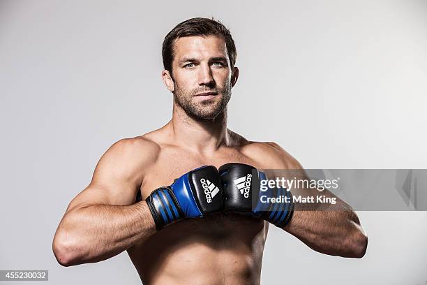 Luke Rockhold poses during the UFC Fight Night: Rockhold v Bisping Press Event at Museum of Contemporary Art on September 11, 2014 in Sydney,...