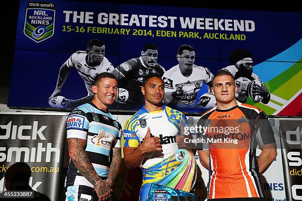 Todd Carney of the Cronulla Sharks, Willie Tonga of the Parramatta Eels and Robbie Farah of the Wests Tigers pose with the NRL Auckland Nines trophy...