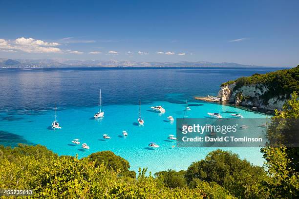 view across turquoise sea, voutoumi bay, antipaxos - greece stock pictures, royalty-free photos & images