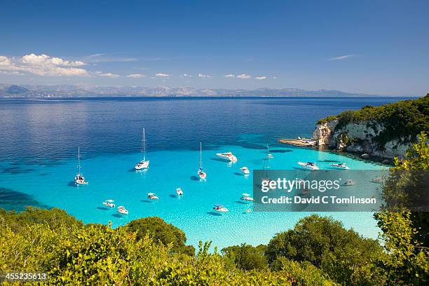 view across turquoise sea, voutoumi bay, antipaxos - paxos stock pictures, royalty-free photos & images