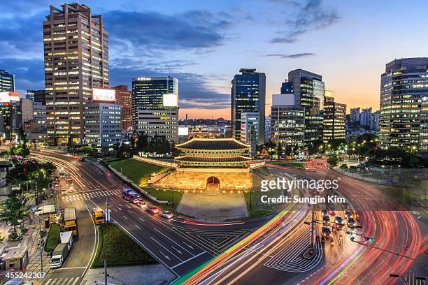 old fortress gate with light trails at downtown - koreaans stockfoto's en -beelden