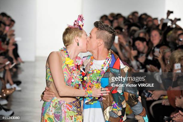 Jeremy Scott and Miley Cyrus walk the runway at the Jeremy Scott fashion show during MADE Fashion Week Spring 2015 at Milk Studios on September 10,...