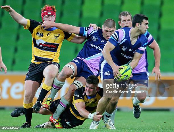 Jack Debreczeni of the Rising makes a break during the round four National Rugby Championship match between Melbourne Rising and Perth Spirit at AAMI...