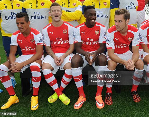 Alexis Sanchez, Jack Wilshere, Danny Welbeck and Aaron Ramsey of Arsenal during the 1st team squad photo at London Colney on September 11, 2014 in St...