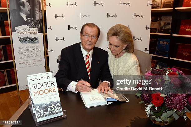 Roger Moore signs copies of his new book "Last Man Standing: Tales from Tinseltown" alongside wife Kristina Tholstrup at Harrods Bookshop on...