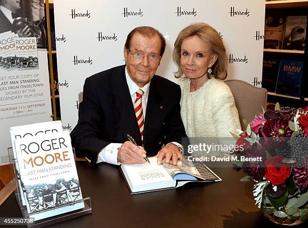 Roger Moore signs copies of his new book "Last Man Standing: Tales from Tinseltown" alongside wife Kristina Tholstrup at Harrods Bookshop on...